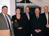 Helena Findlen (2nd from left) receives the Humanitarian Award from the IAPOA Executive Board. (Moira Sweetland photo)