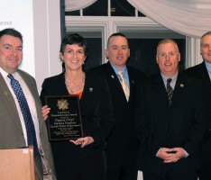 Helena Findlen (2nd from left) receives the Humanitarian Award from the IAPOA Executive Board. (Moira Sweetland photo)
