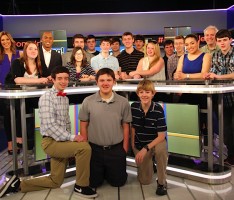 Students on the set of “OMG! Insider” with hosts Thea Andrews and Kevin Frazier. Andrews and Frazier taped shout-outs to put on Canton Community Television promoting the Student Station.