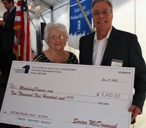 Joel Pratt accepts a donation to MatchingDonors.com