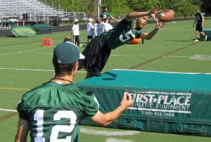 Derrick Harris (pictured above at a youth clinic) led the Bulldogs with almost 100 yards receiving.