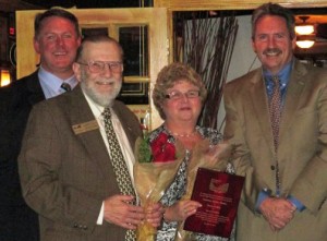 Steve and Sharon Fradkin (center) accept their honorary lifetime membership.