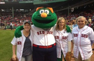 McCarthy is pictured at left at Fenway Park with Wally the Green Monster, National Grid MA President Marcy Reed, and U.S. Energy Secretary Ernest Moniz.