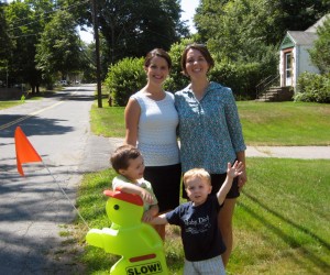 (L-R) Siobhaun Johnson with her son Luke, 3, and Adrienne Sullivan with her son, Caleb, 2, with one of Messinger Street’s “little green men.”