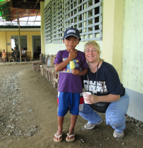 Melissa Fantasia poses for a photo with a little boy in Tapaz.