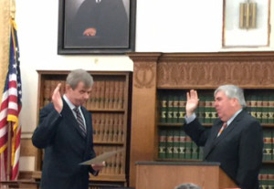 Secretary of State William Galvin (left) administers the oath of office to DA Michael Morrissey at Norfolk Superior Court.