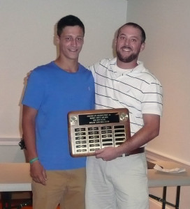 Head coach Greg Lyons congratulates Kevin Powers (left) on joining the .400 Club. (Mike Berger photo)