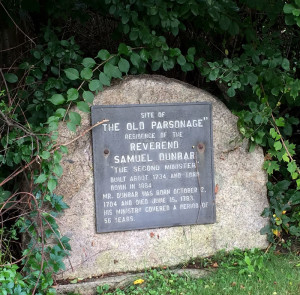 Today, an almost hidden stone marker memorializes the spot near the Old Manse. (Photo by the author)