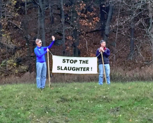 Hunting opponents protest at the entrance to the Blue Hills in Canton. (Photo courtesy of Jeremy Comeau)