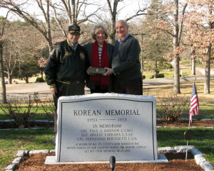 Tony Andreotti with Jane and Charlie Tardanico in front of the monument honoring Paul Hannon, who was killed in action in Korea