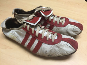 Spikes worn by Jerry Govatsos when he set the school long jump record in 1961