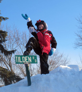 Samantha Sweenie, 7, scales a massive snow bank at the end of Tilden Road.