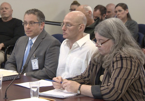 Rod Matthews (center) appears before the parole board.