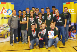 The CHS Robodogs with coaches Leo Nelson (left) and mentor Chris Thomas (right) at the conclusion of the state championship meet