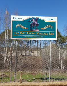 A sign touting the future home of the Paul Revere Heritage Site stands in front of the diversion channel on Neponset St.