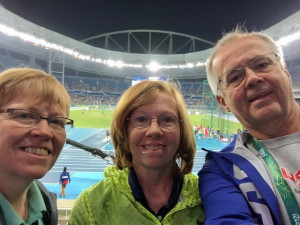 Chris Flynn, Elaine Lovett and Ed Ryan at the Olympic track and field stadium