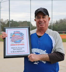 Joe DeFelice displays the championship plaque.