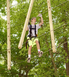 A young climber traverses a course at TreeTop Adventures. (Michelle Stark photo)