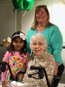 Kathy Fox Alfano, founder and chairperson of Canton Writes, with this year’s youngest winner, first grader Avika Shukla, and eldest winner, Betsy Sterman