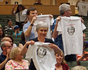 Attendees unveil their “Frau Rocks” t-shirts. At front is Betty Chelmow, who has hosted many exchange students through the years.